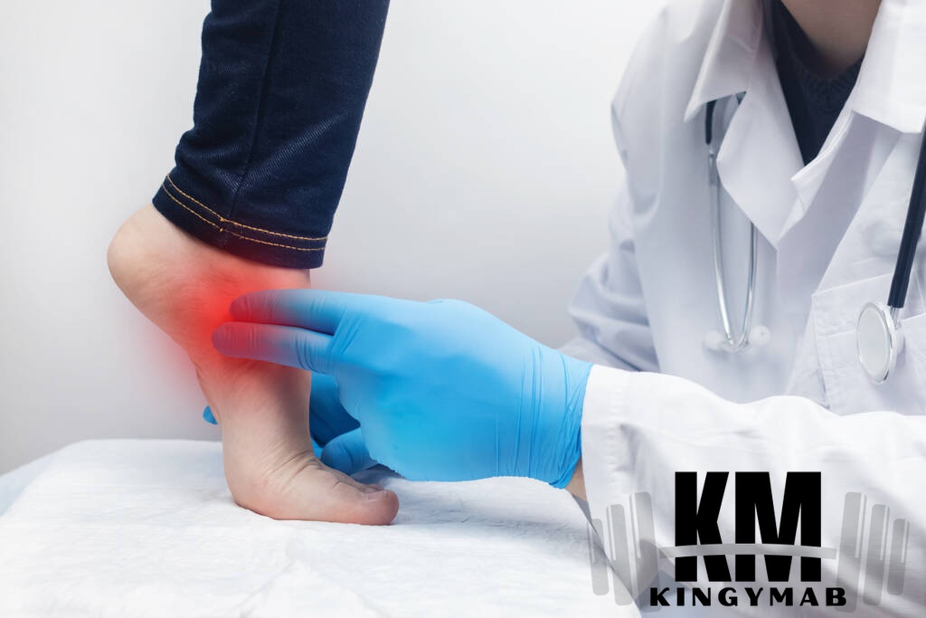 Orthopedic surgeon examines woman leg foot pain tendon sprains inflammation
