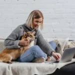 young girl watching movie with dog