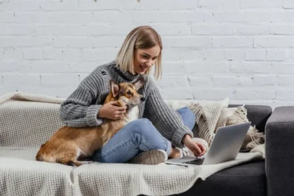 young girl watching movie with dog